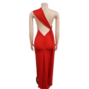 Detail view of red backless evening gown featuring ruched back and asymmetric shoulder