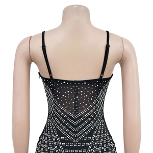 Detail of black mesh mini dress with silver rhinestones in geometric V-shaped pattern