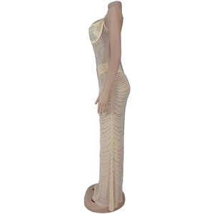 Detail of nude mesh gown featuring shimmering silver rhinestones in a wave pattern