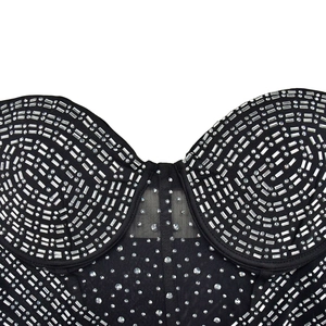 Detail of black mesh corset top featuring silver rhinestones and sweetheart cup design