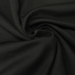 Close-up of black knitted fabric with vertical ribbed texture and dense weave