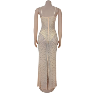 Close-up of mesh evening dress back with silver rhinestones and a hidden zipper