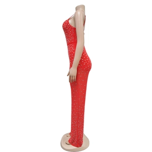 Close-up of red slim fit jumpsuit with sparkling rhinestones and open back design