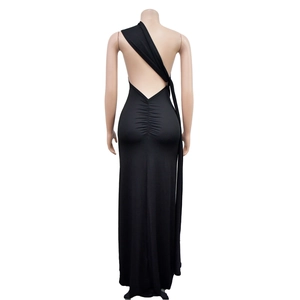 Detail of black backless maxi dress featuring elegant ruching and a slim fit cut