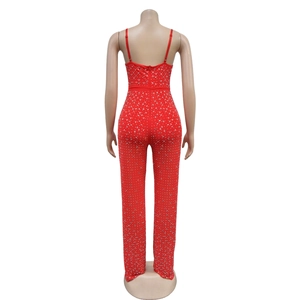 Back view of red slim jumpsuit with silver rhinestones and thin shoulder straps