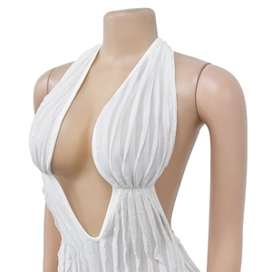 Detail of white deep V-neck bodysuit featuring vertical pleated texture and backless design