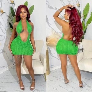 Bright green halter backless mini dress with hollow out details and textured fabric