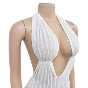 Detail view of white deep V-neck halter top with pleated chiffon fabric on a mannequin