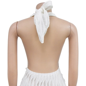 Detailed back view of white halter neck top with open back and pleated texture fabric