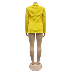 Detailed back view of yellow blazer featuring elegant pearl beads on the long sleeves