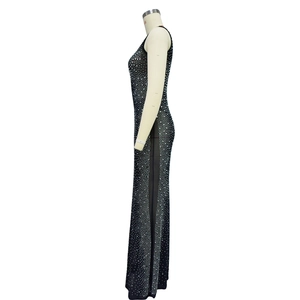 Close-up of black mesh maxi dress featuring intricate silver rhinestone embellishments