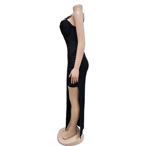 Detail of elegant black bodycon dress featuring side slit with sheer mesh ruffle inserts