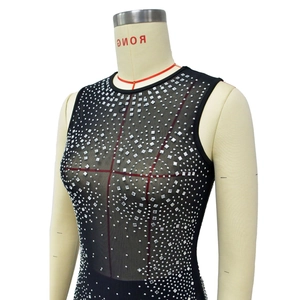 Detail of black mesh bodysuit with silver rhinestones and sleeveless design on mannequin