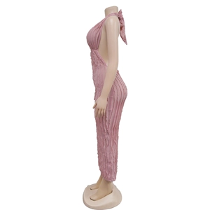 Side view of pink backless maxi dress with halter neck and 3D pleated texture fabric