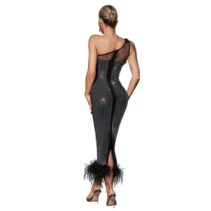 Rear view of black one-shoulder dress with silver rhinestones and feather trim hem