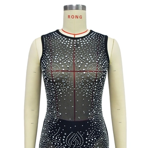 Detailed view of black mesh bodysuit featuring silver rhinestone geometric patterns in size S