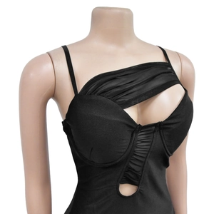 Detail of black mesh cutout bodysuit with one-shoulder design and ruched fabric texture