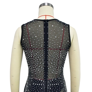 Detail of black mesh back with silver rhinestones and a central zipper closure