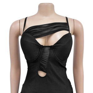 Detail of black one-shoulder bodysuit featuring sheer mesh panels and cutout waist design