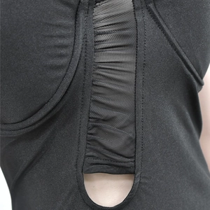 Detailed view of black mesh patchwork and ruching on the sleek bandage maxi dress
