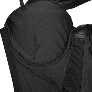 Detail of corset dress featuring underwire cups and pleated mesh side panels in black