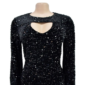 Detail of the heart-shaped cutout and shiny black sequins on this stylish mini dress