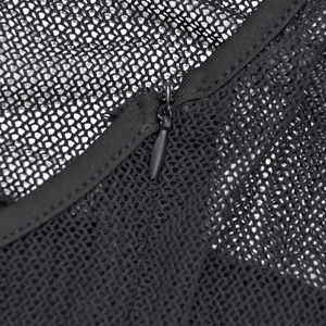 Detail of black mesh bandage dress featuring a premium invisible zipper closure system