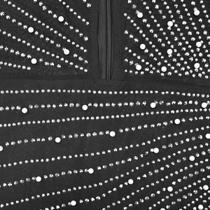 Detail shot of mesh dress with zipper closure featuring hot-fix rhinestones and pearls