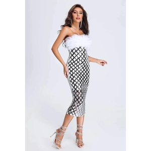 Detail of sequined bodycon dress featuring white feather trim and silver diamond pattern