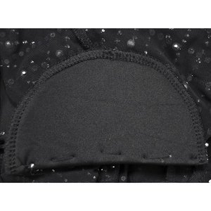Detail of internal shoulder pad lining and sparkling mesh fabric on black mini dress