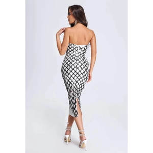 Detailed back view of sequin bodycon dress showing slit and black white rhombus pattern