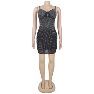 Dettaglio del mini abito nero con strass argentati geometrici e spalline sottili