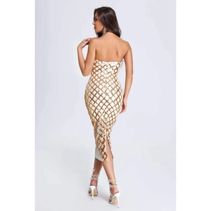 Close-up of white tube dress back featuring gold sequin grid and elegant hem slit