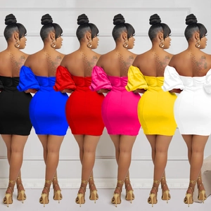 Back view showing multiple colors and ruched backless design of the mini dress