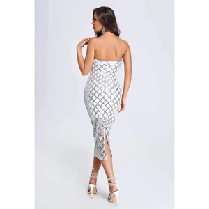 Close-up of sparkling silver sequin lattice pattern on white bodycon tube dress