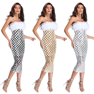 Detailed view of sequin bodycon dress with white feather trim and diamond pattern