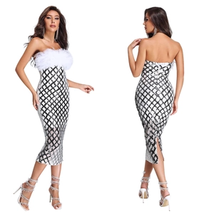 Detail of sequin lattice pattern and white feather trim on the strapless dress