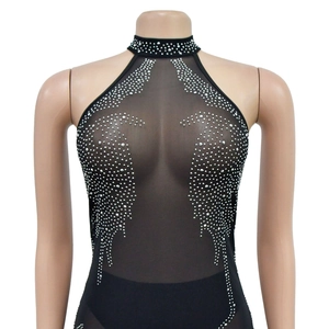 Detail of sheer black mesh halter neckline with intricate rhinestone wing patterns