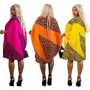 Loose batwing sleeve mini dress with bold leopard print and geometric color blocking