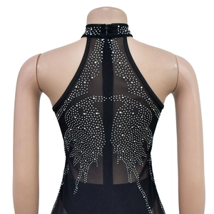 Detailed back view of mesh dress with sparkling silver rhinestone wing patterns