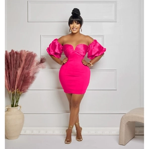 Detail of hot pink off-shoulder dress with satin puff sleeves and ruched bodycon design