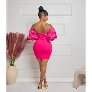 Detail view of hot pink off-shoulder mini dress with puff sleeves and back pleats