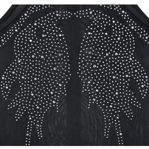 Detail of black mesh fabric with symmetrical silver rhinestone animal pattern design