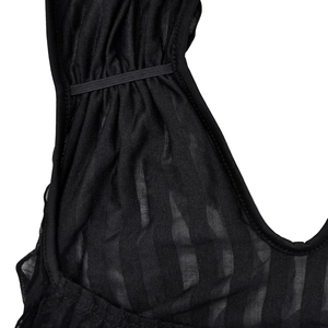 Macro detail of black sheer wavy striped fabric with elastic gathered edge on summer dress