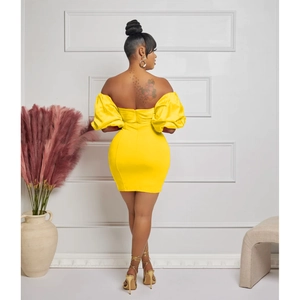 Rear view detail of yellow off-shoulder mini dress with pleated back and puff sleeves