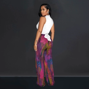 Detail of white sleeveless tie-back top and colorful geometric print wide-leg trousers