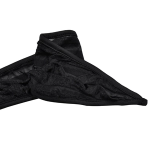 Detail of black mesh fabric with wavy pleated texture and fine knitted edge trim