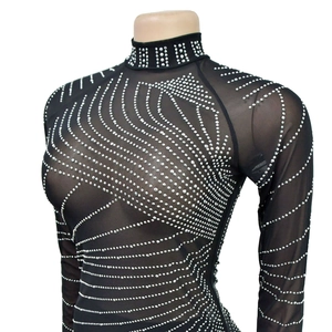 Close-up of black mesh top featuring rhinestone swirls and stand-up collar detail