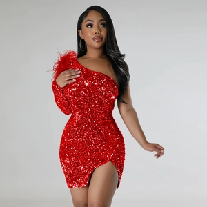 Detailed close-up of a red sequin dress with elegant feather decor on the shoulder