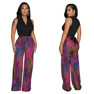 Front and back view of a black V-neck sleeveless top with colorful abstract wide-leg pants